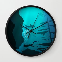 Beautiful coral reef and silhouettes of diver and school of fish in a blue sea Wall Clock