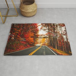 autumnal road in vermont Rug